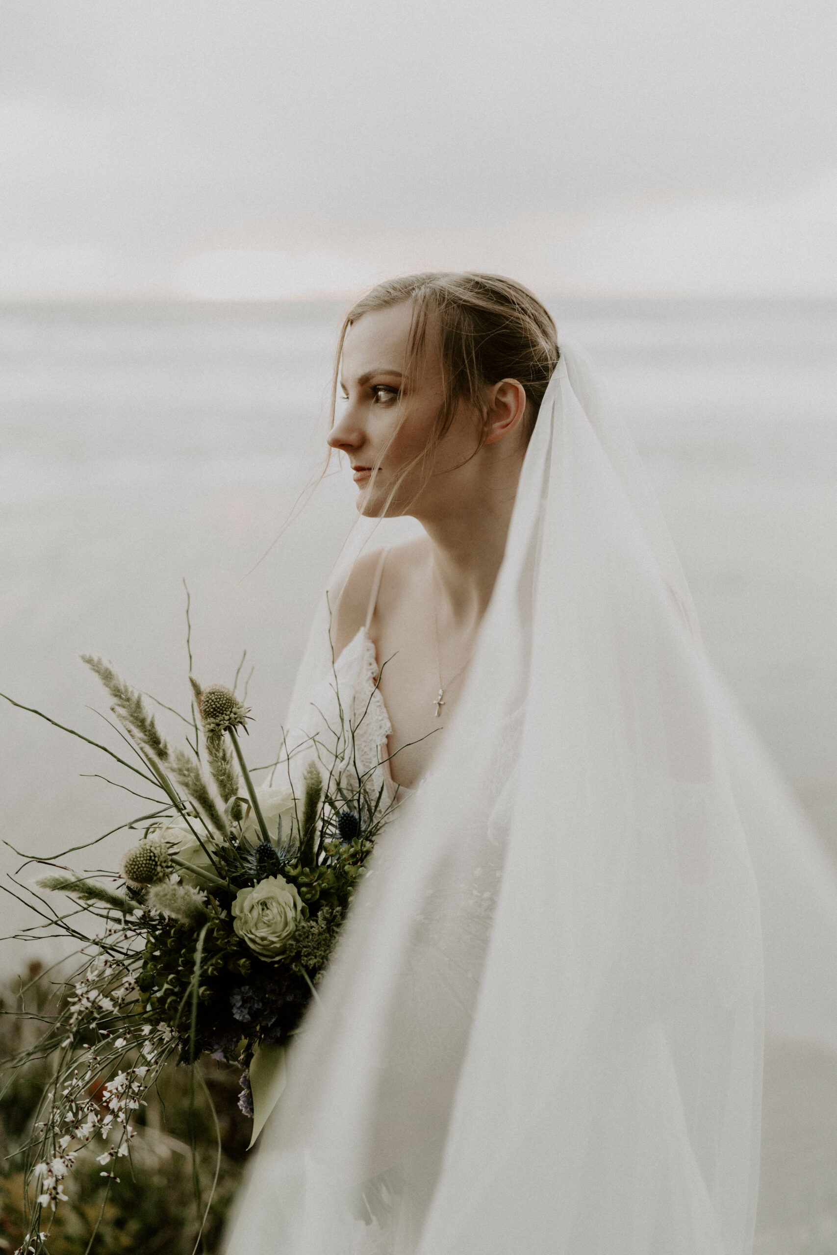 Editorial Bride Standing Near Ocean In Florida